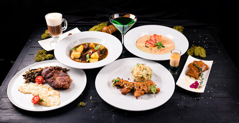 Irish dinner. Beef meat stewed with potatoes, carrots and soda bread on wooden background, top view, copy space. Homemade winter comfort food - slow cooked