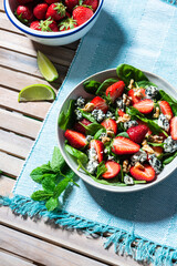 Fresh Sumer Salad with Strawberry on Table.