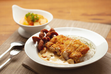Chicken curry and fried sausage