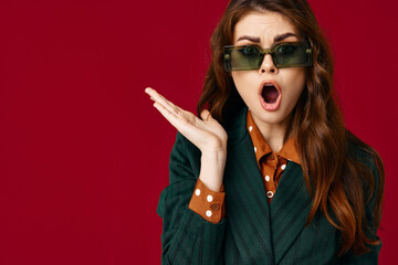woman wearing sunglasses fashion cropped view red background