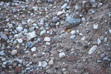 Background texture for decorating small pebbles and seabed gravel. Pile of sand and gravel with big rocks