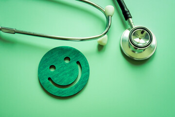 Patient satisfaction concept. Stethoscope and smile face as good assessment.
