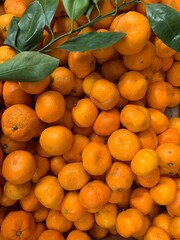 lots of ripe citrus tangerine for eating as a background