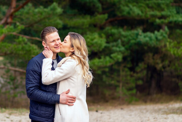 Happy loving couple kissing enjoying of happiness love and tenderness,romance.Couple hugging in love at spring park.