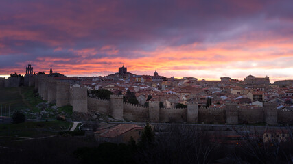 Fototapeta premium Panoramic view of the medieval town walls of Avila from Los Cuatro Postes Calvary, Spain