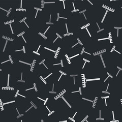 Grey Garden rake icon isolated seamless pattern on black background. Tool for horticulture, agriculture, farming. Ground cultivator. Housekeeping equipment. Vector