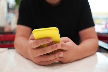 Man playing game on mobile phone. gamer boy playing video games holding Smartphone working mobile...