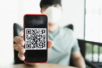 Qr code payment. E wallet. Man scanning tag accepted generate digital pay without money.scanning QR code online shopping cashless payment and verification technology concept