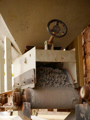 concrete mixer machine steering wheel presenting around industrial background.