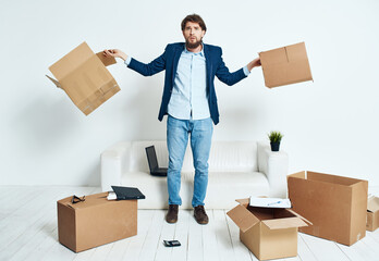 manager with cardboard boxes office moving professional