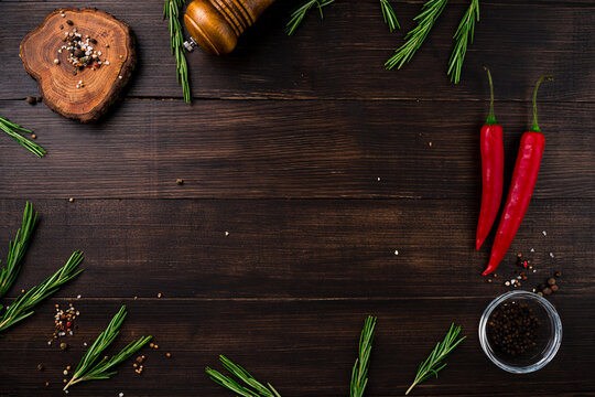 Herbs and spices at wooden table. Cooking or food background. Food ingredients.