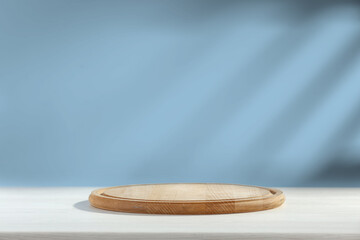 Kitchen desk of free space and blue wall background with shadows 