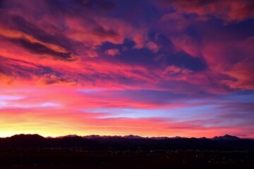 Fototapeta na wymiar spectacular pastel-colored sunset over long's peak and the front range of the colorado rocky mountains, as seen form broomfield, colorado