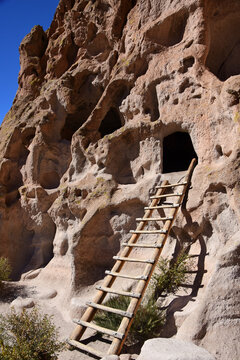 wooden ladder and ancient native american cave dwelling cavate at bandelier national monument, near los alamos, new mexico