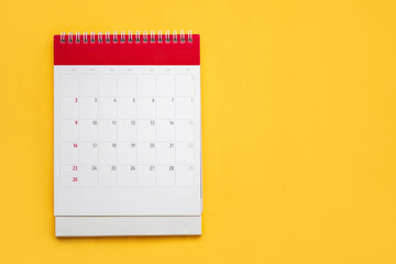 calendar page on yellow background business planning appointment meeting concept