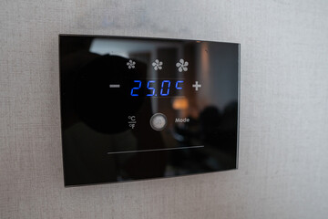 modern digital air condition panel on wall
