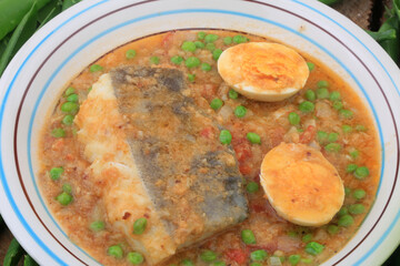 cod with green peas and egg as sea food with vegetables healthy eating