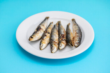fried sardines on white small dish