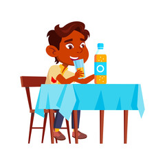 Boy Child Drinking Natural Juice At Table Vector. Thirsty Indian Preteen Kid Sitting At Desk In Dining Room And Drink Delicious Juice Cup. Character Refreshment Flat Cartoon Illustration