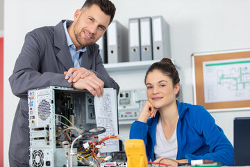 supervisor with female apprentice computer technician