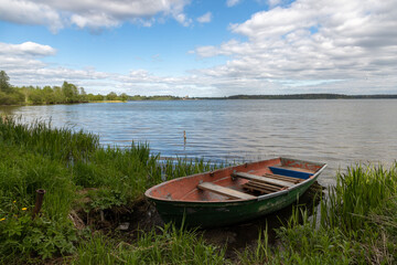 Naklejka na ściany i meble Valdai National Park. Boat on Lake Valdai. Novgorod region. Russia.