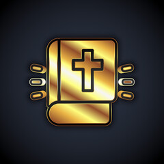 Fototapeta premium Gold Holy bible book icon isolated on black background. Vector