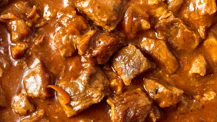 Traditional goulash meat food background. Macro, selective focus