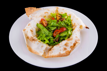 Warm salad in thin pita bread: beef, mushrooms, cherry tomatoes, Dijon mustard, cognac.