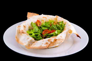 Warm salad in thin pita bread: beef, mushrooms, cherry tomatoes, Dijon mustard, cognac.