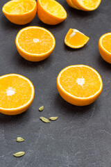 Orange halves and cardamom on table