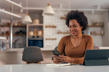 Adult woman, checking her mail on the phone.