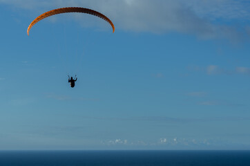 PARAGLIDING ON A SUNNY DAY