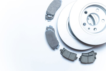 Naklejka premium Car motor parts. Auto motor mechanic spare or automotive piece on white background. New metal car part. Flat lay, top view, copy space.