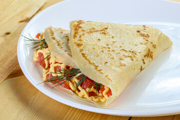 Pancake with salmon fiilet and cheese