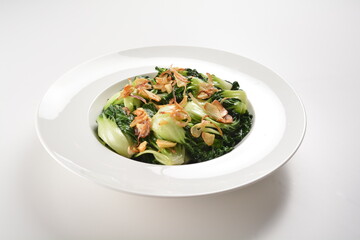 stir fried vegetable nai bai with garlic and mushroom in oyster sauce in white plate asian halal menu