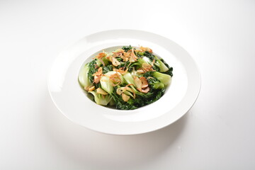 stir fried vegetable nai bai with garlic and mushroom in oyster sauce in white plate asian halal menu