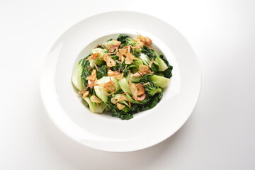stir fried vegetable nai bai with garlic and mushroom in oyster sauce in white plate asian halal menu