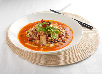 stir fried mapo tofu bean curd in spicy mala chilli sauce in white plate asian halal menu