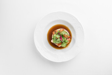 Starter plate with eel, quinoa and cucumber isolated on white background