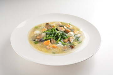 stir fried water spinach vegetable with trio eggs in thick gravy sauce in white plate asian halal menu