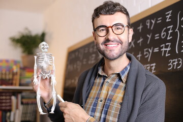 Cute teacher explaining human anatomy