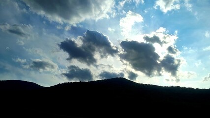 Sun is hiding behind clouds on mountain Igman, Bosnia and Herzegovina