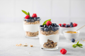 Granola with yogurt, blueberries and raspberries. Healthy breakfast. Menu, recipe.