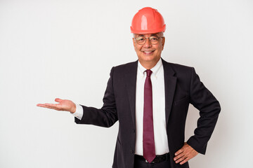 Senior american arquitech man isolated on white background showing a copy space on a palm and...