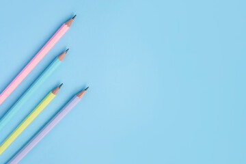 Colored pencils  on a pastel blue background  with copy space for text . Back to school   banner concept