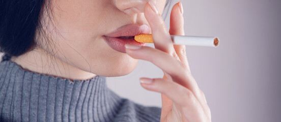 girl holds a cigarette in her hand and wants to smoke
