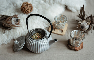 Cozy home composition with teapot and home decor details.