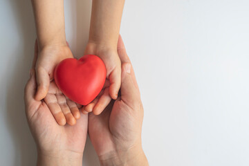 red heart in hand.social responsibility concept.family,health and life insurance concept.organ donation,world heart health day.cardiology day.