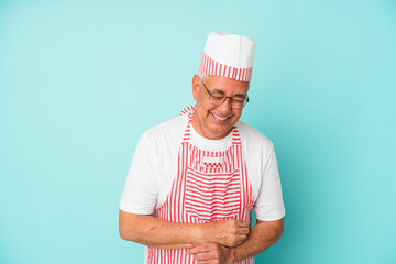 Senior american ice cream man woman holding isolated on blue background laughing and having fun.