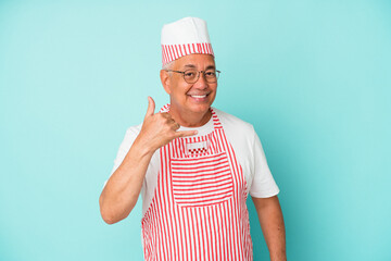 Senior american ice cream man woman holding isolated on blue background showing a mobile phone call gesture with fingers.